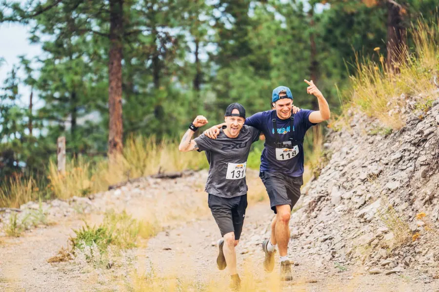 Two runners sprinting the last stretch of gravel